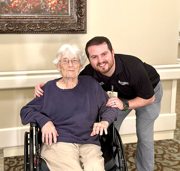 staff member and resident smiling